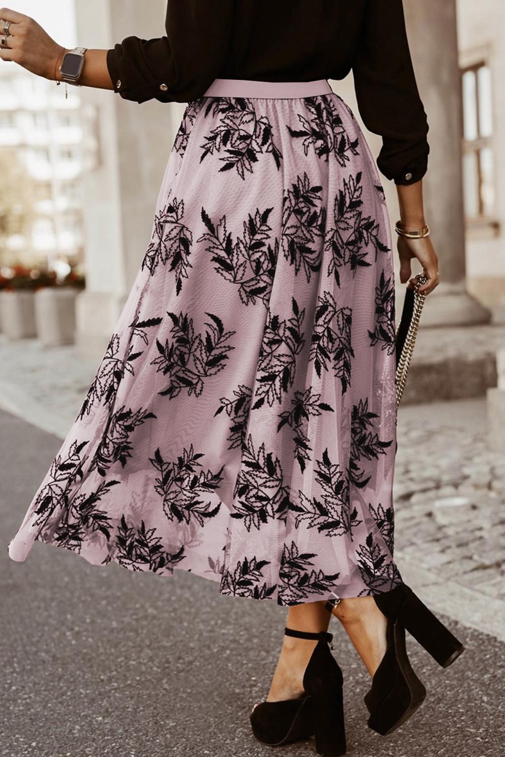 Flowy peach blossom embroidered maxi skirt with high waist design.
