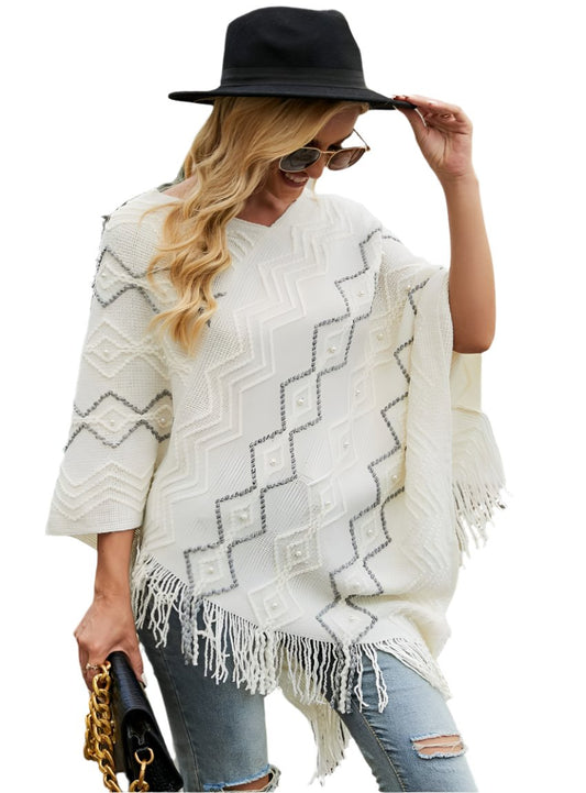 White pearl-trimmed poncho with fringe
