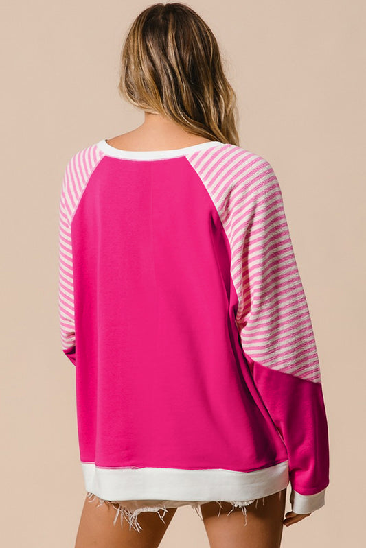 casual pink pullover with white and pink stripes on the sleeves
