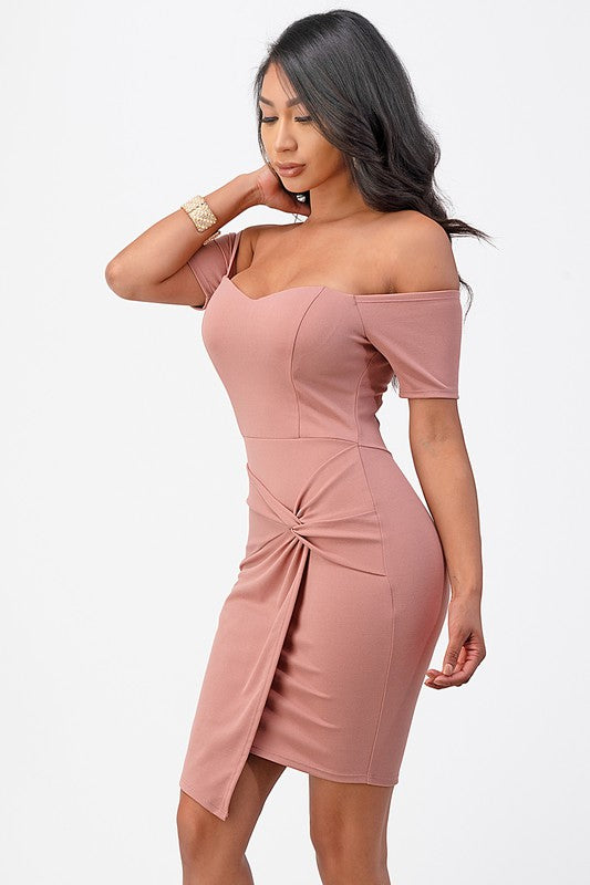 Pink dress featuring an off-shoulder neckline with twist-front design for formal looks.
