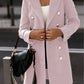 Front shot of a pink double-breasted woolen coat with feminine appeal.
