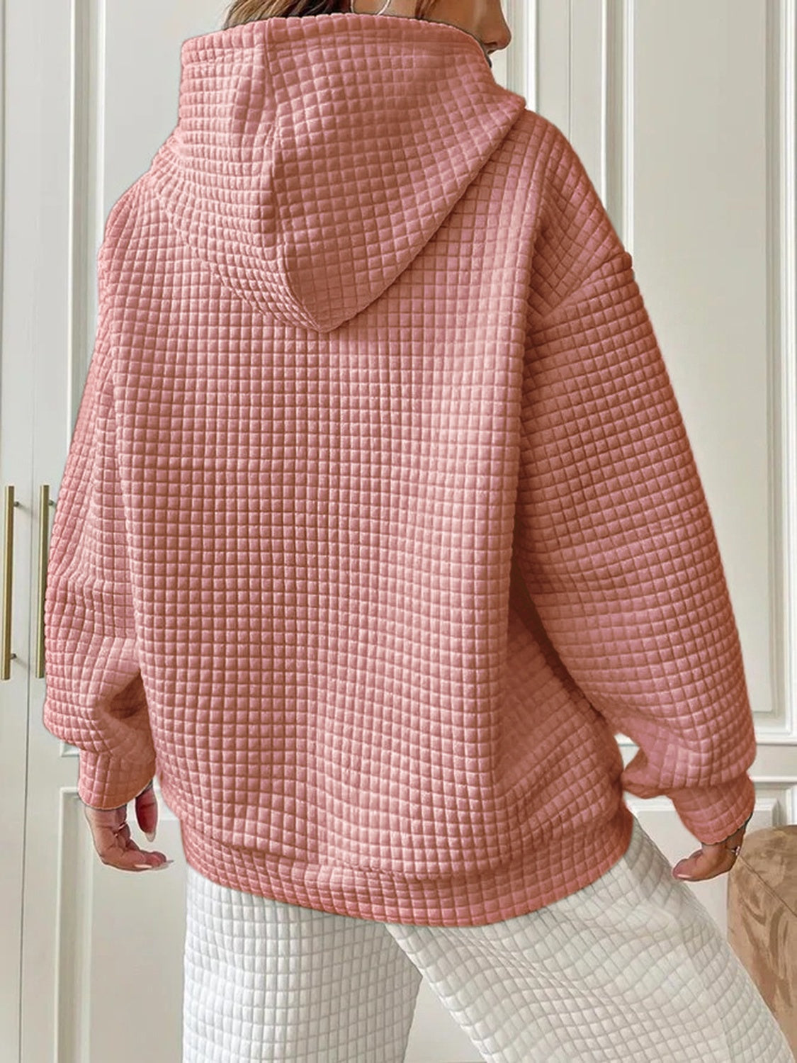 textured pink hoodie with drawstring hood
