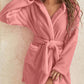 Pink fleece hooded robe, stylish and comfortable for loungewear.
