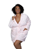 Woman wearing a pink polka dot plush robe with a front tie belt, styled for loungewear.
