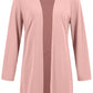 Woman wearing a pink 3-piece pant suit, a chic choice for formal or casual occasions