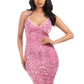 Front view of a pink sequin bodycon dress with spaghetti straps and a v-neckline.
