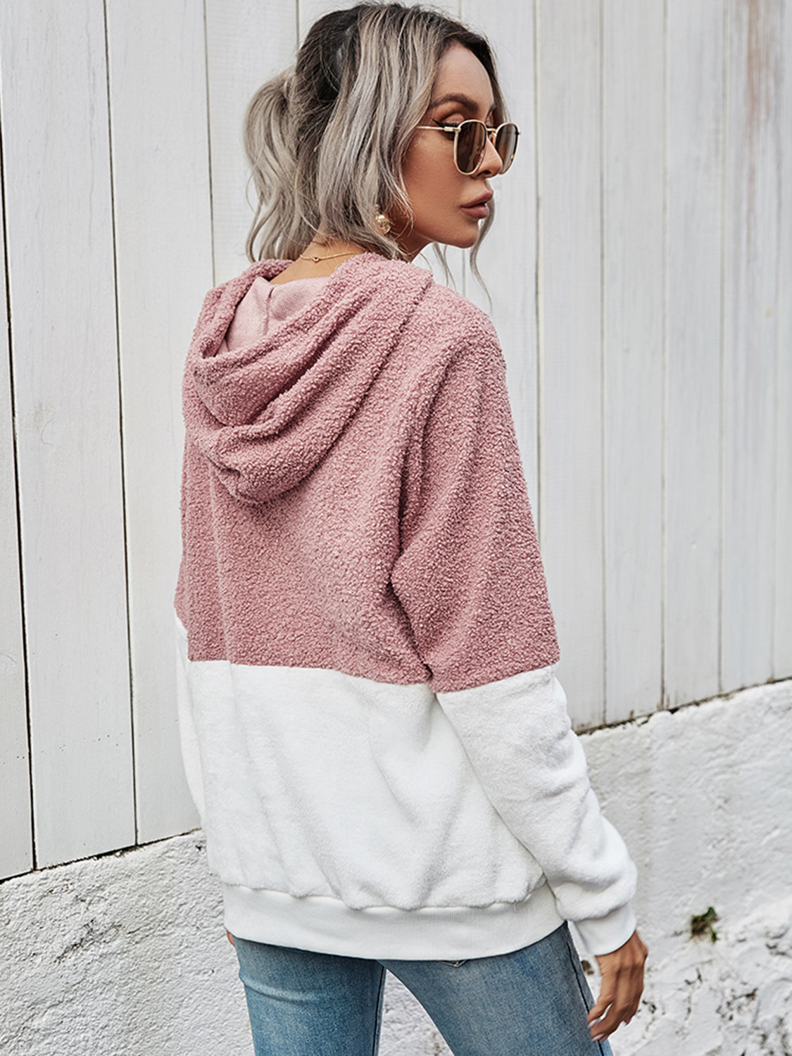 Ultra-soft color-block sherpa hoodie in pink and white tones.
