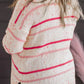 Fun, speckled knit sweater in plus size with vibrant pink stripes.
