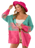 Pink and teal cardigan with fun pompom accents and open front
