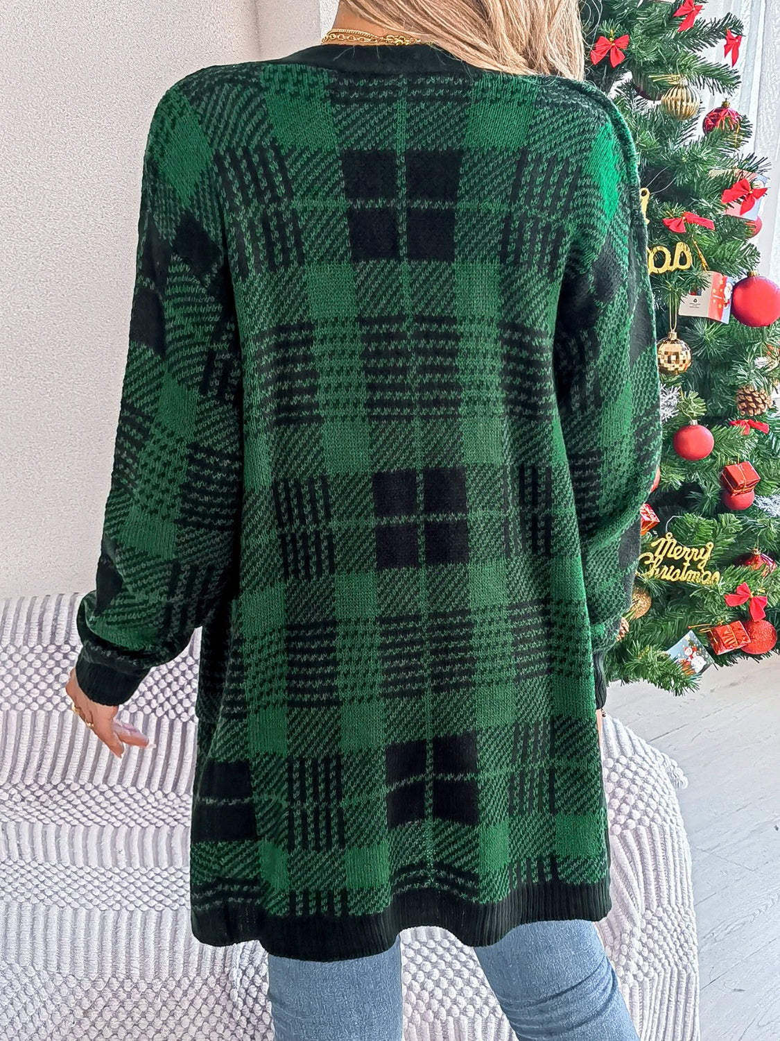 Back view of dark green plaid open-front cardigan for women
