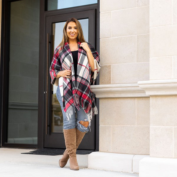 Bold red and black plaid shawl with soft fringe.