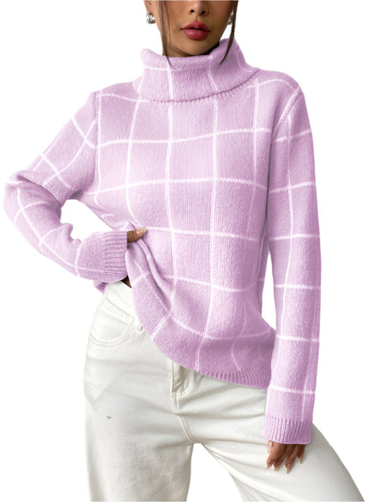 Woman wearing pink plaid turtleneck sweater with white pants