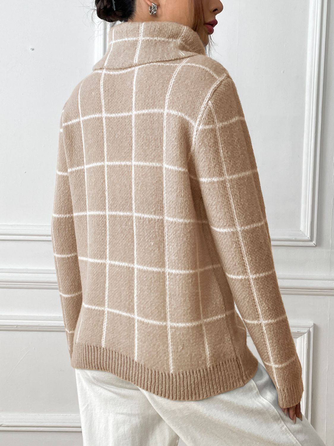 Cozy tan plaid sweater styled with jeans for a casual day out