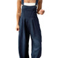 Front view of Plaid Wide Strap Wide Leg Overalls styled with a white tank top.
