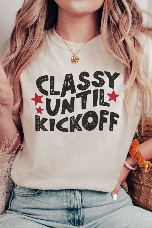 Tan "Classy Until Kickoff" shirt with relaxed fit and rolled sleeves.