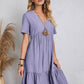 Playful purple babydoll dress with a V-neckline and flowy silhouette, perfect for summer
