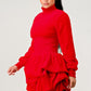 Playful red dress with long sleeves and a ruffled skirt, ideal for various occasions.
