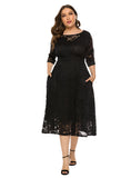 Front view of plus-size black lace midi dress with round neckline and 3/4 sleeves.
