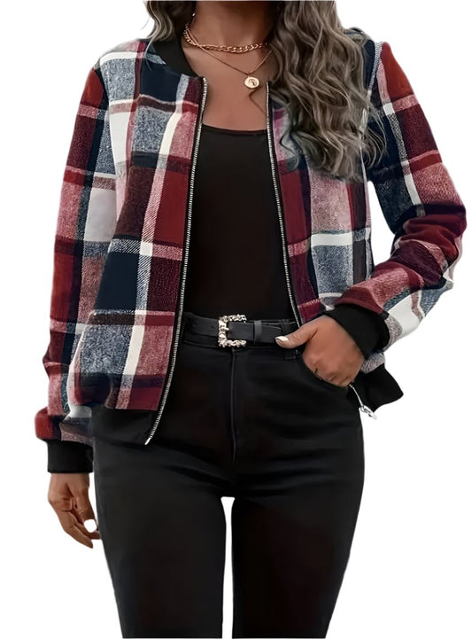 Woman wearing a plus-size burgundy plaid zip-up jacket styled with black pants.
