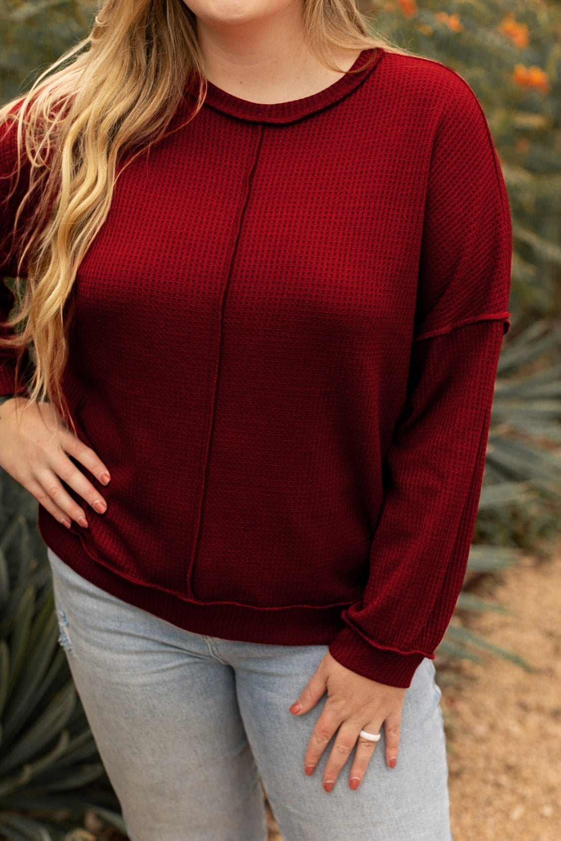 Fall-ready plus-size burgundy knit top with comfy, relaxed fit