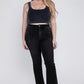 Front detail of stretchy plus-size high-rise crop flare jeans in black.
