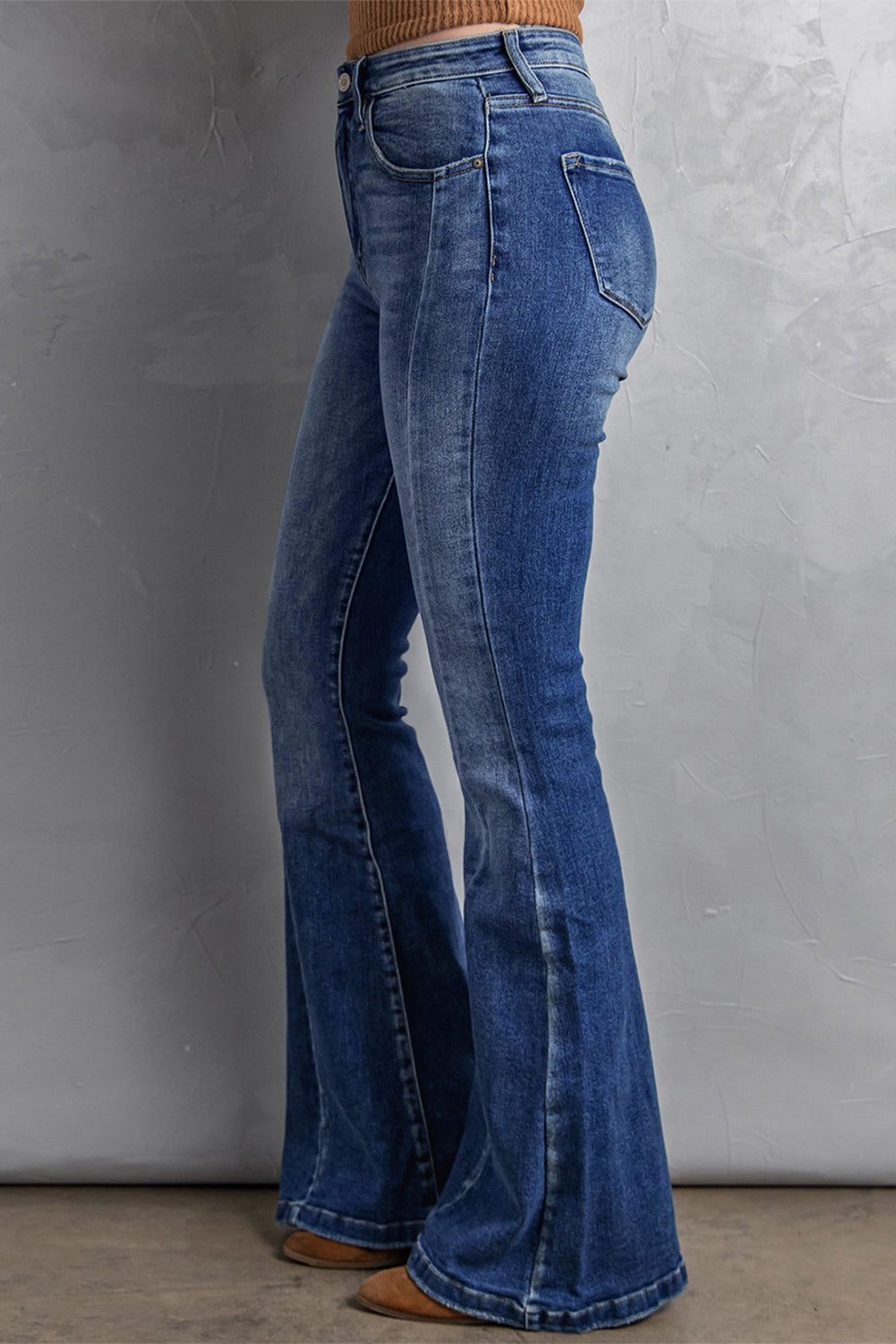 Trendy washed flare jeans with stitching details for plus size women.
