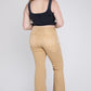 Full-length tan denim jeans with a relaxed fit and distressed accents.
