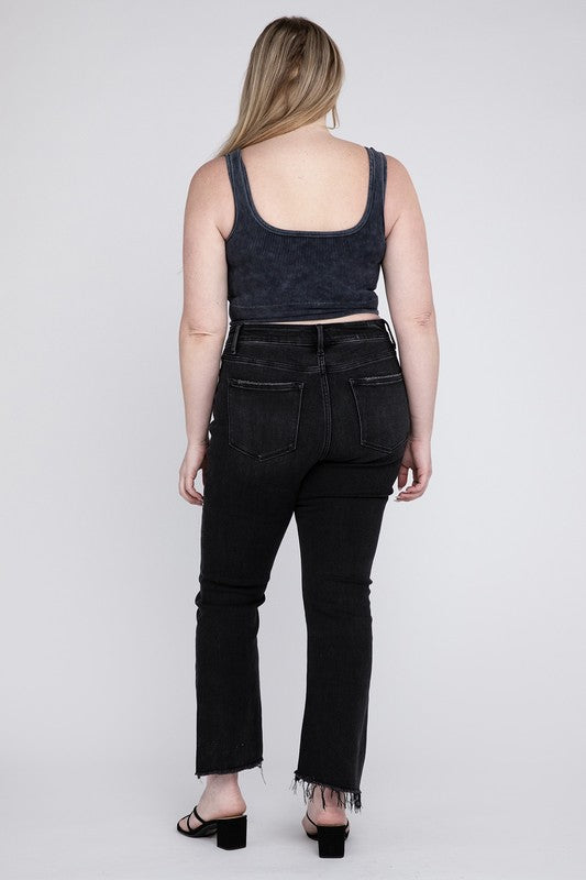 Back view of black plus-size crop flare jeans featuring a trendy frayed hem.
