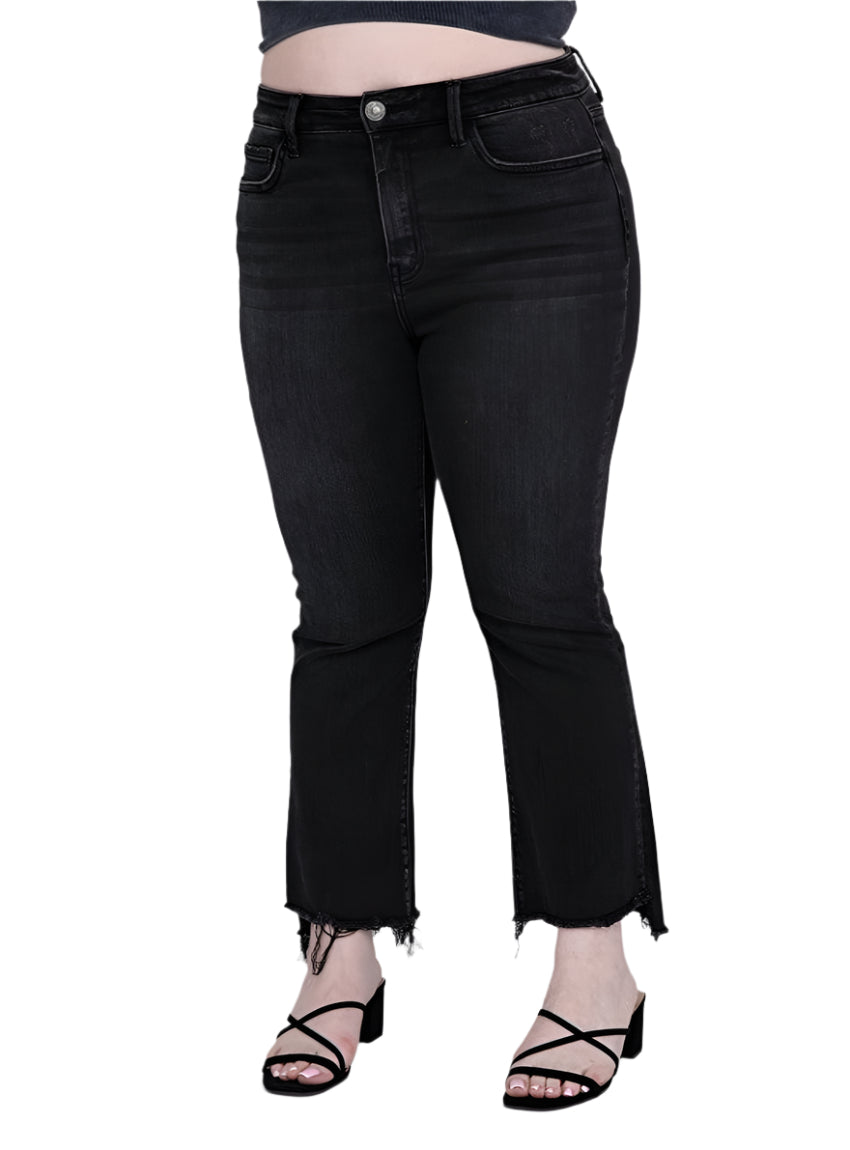 Front view of plus-size high-rise crop flare jeans in black denim with frayed hem.
