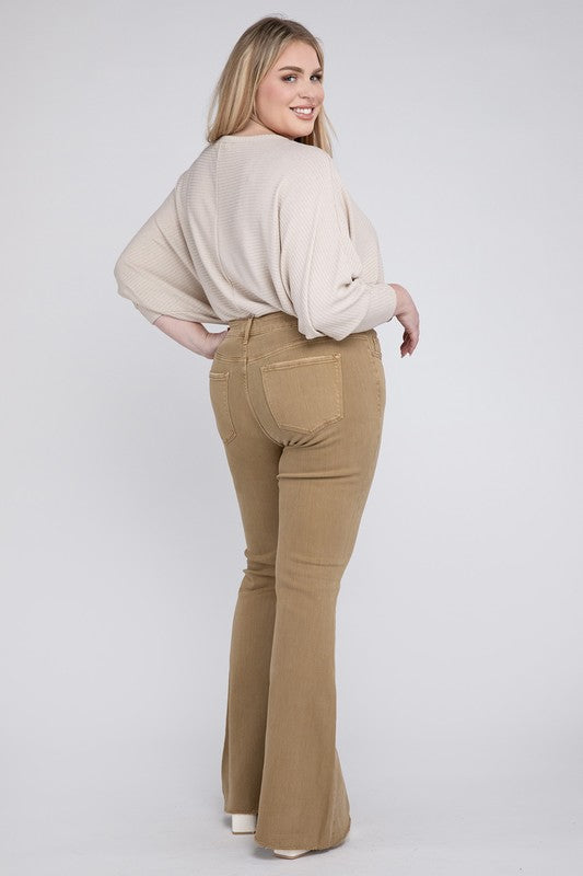 Back view of plus size high rise super flare jeans with full-length silhouette.
