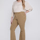 Side view of super flare plus size jeans showcasing retro-inspired design.
