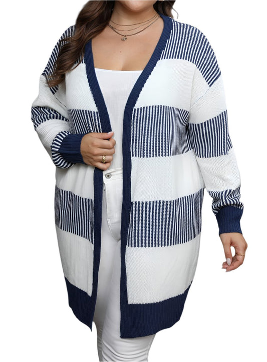 Front view of a plus-size woman in a cozy open-front cardigan in navy and white.