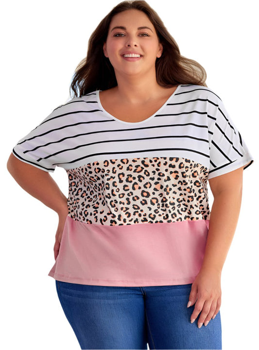 Plus-size woman wearing a color-block top with stripes, leopard print, and blush pink
