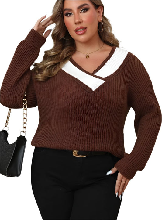 Woman wearing a plus size brown V-neck ribbed knit sweater with black pants