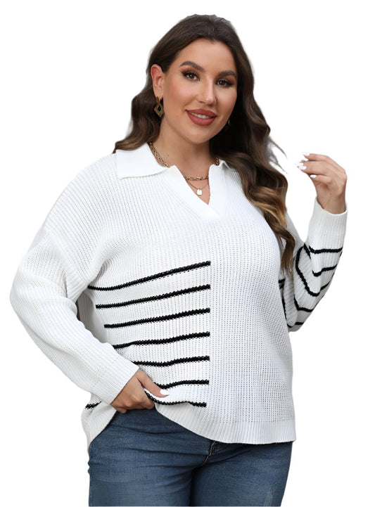 Plus-size woman in a white pullover sweater with black stripe details and a relaxed fit