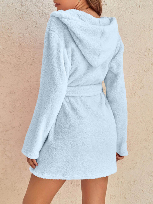 Plush hooded fleece robe in sky blue, shown on model for cozy loungewear.
