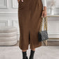 Versatile brown corduroy midi skirt, perfect for fall and winter outfits.
