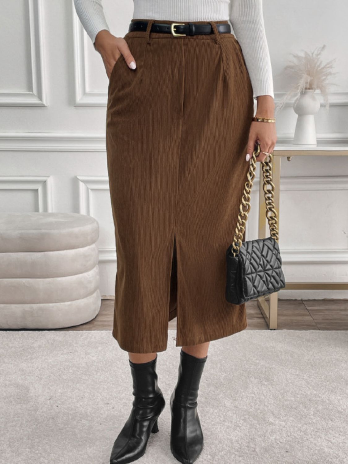 Versatile brown corduroy midi skirt, perfect for fall and winter outfits.
