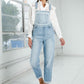 Relaxed fit women’s light wash overall jumpsuit front view
