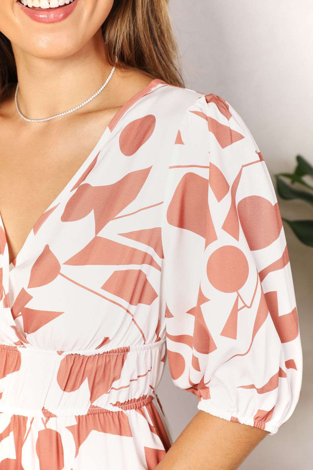 Detail of Printed Surplice Balloon Sleeve Dress in camel