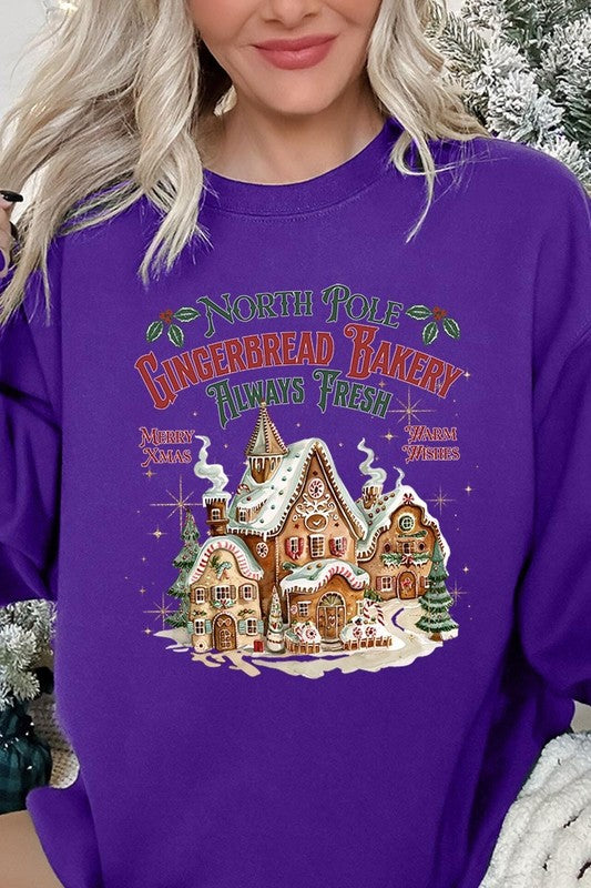 Fun purple holiday sweatshirt featuring North Pole Gingerbread Bakery graphic.