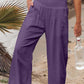 Purple smocked waist wide leg pants with pockets
