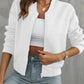 Front view of white quilted bomber jacket, a clean, versatile layering piece.
