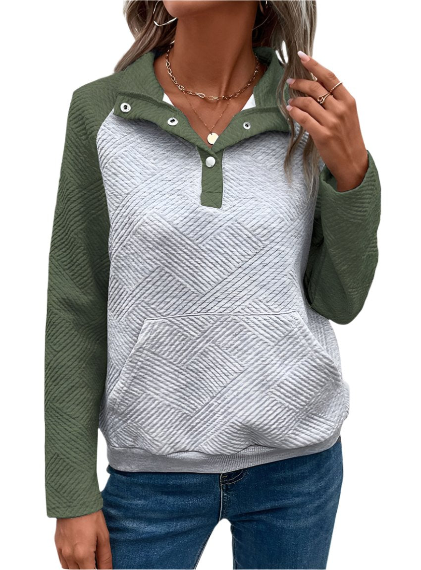 Close-up of a green quilted pullover with a kangaroo pocket and textured detail