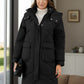 Closeup of front pocket on black quilted puffer coat
