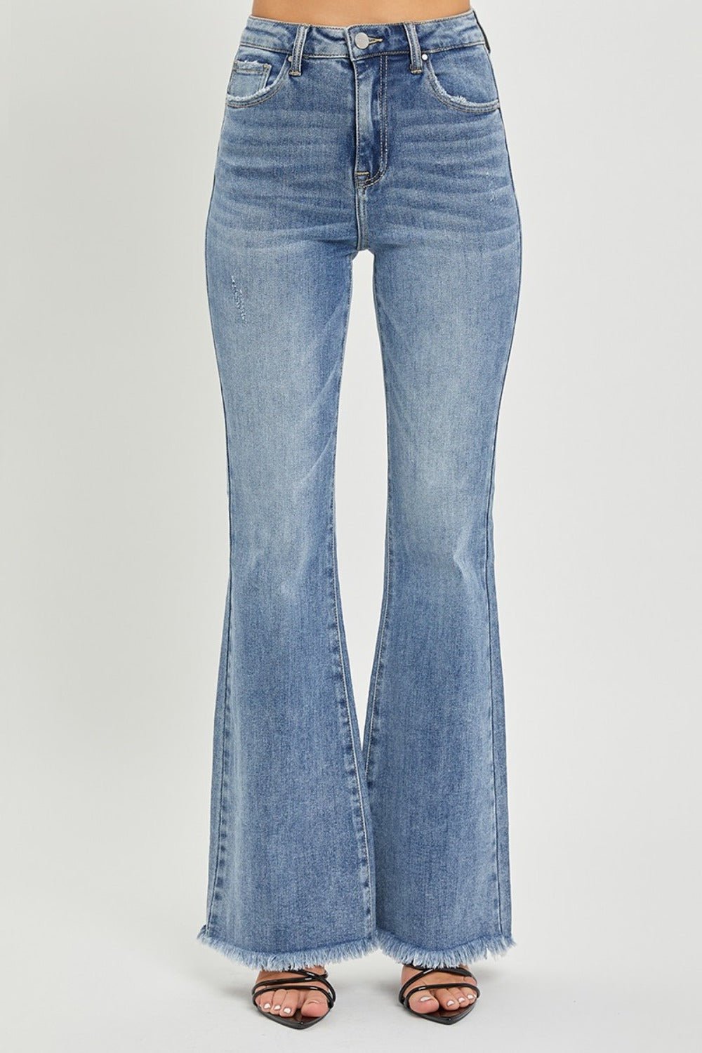 Stylish medium wash flared jeans with raw hem by RISEN
