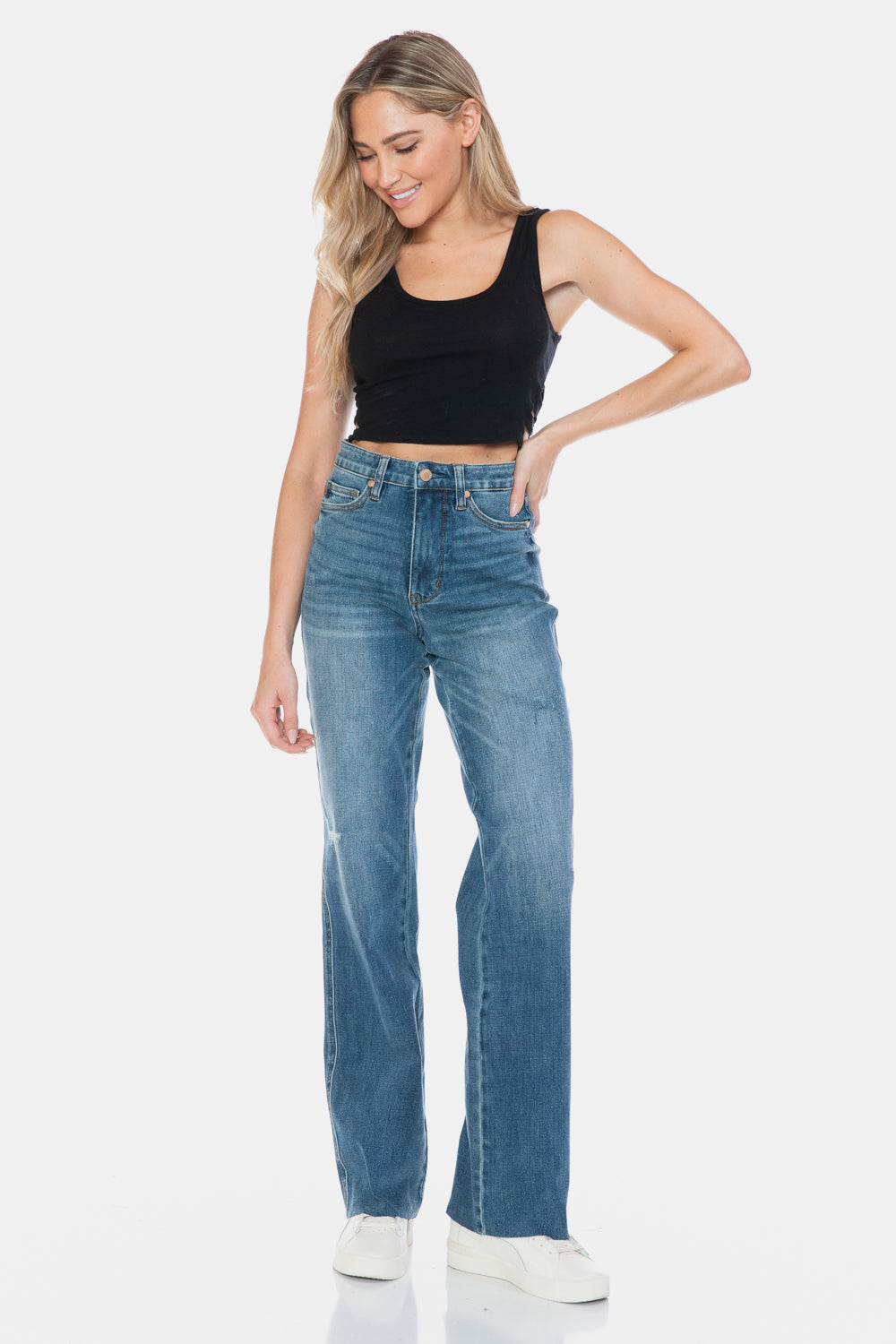 Raw hem straight jeans styled for a chic everyday outfit.
