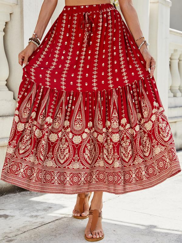 Tiered red skirt with a boho print and flowing silhouette.