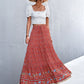 Red bohemian high-waisted skirt with a flattering and elegant fit.
