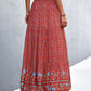 Red boho long skirt featuring a bold floral pattern and flowy design.
